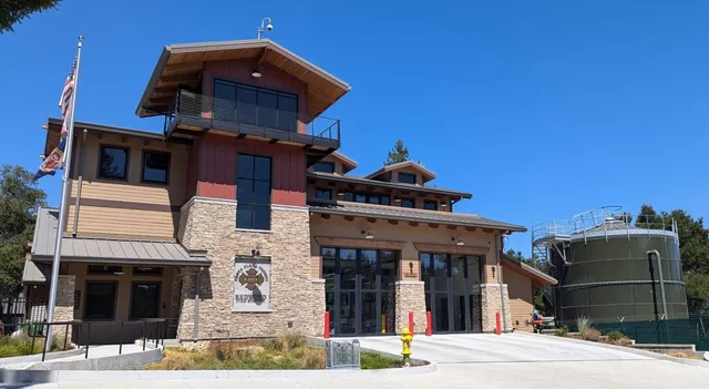 a front view of a house with a parking area