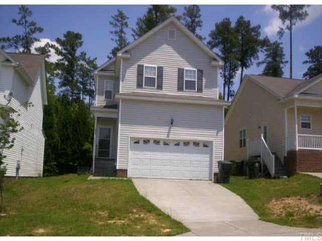 4213 Beacon Crest Way Raleigh, NC 27604 - Photo 1 of 6 front view of house with a yard and a trees