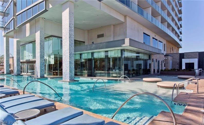 4381 West Flamingo Road, Unit 15310 Las Vegas, NV 89103 - Photo 36 of 52 Community pool with a patio area