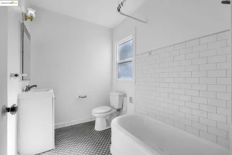 a view of a livingroom with furniture and a dresser