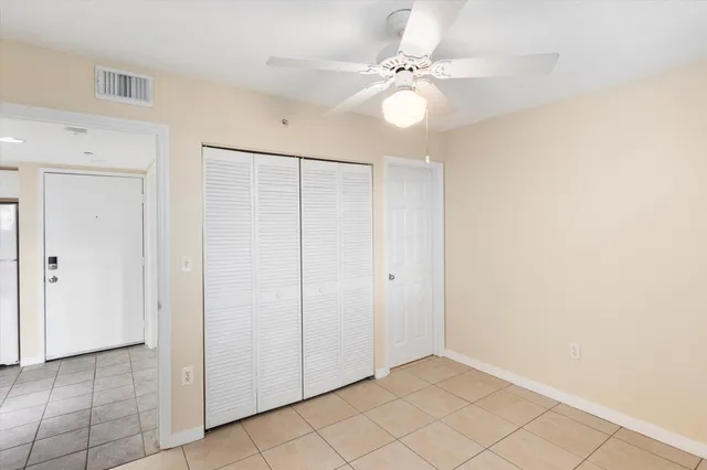 a front view of a building with a garden