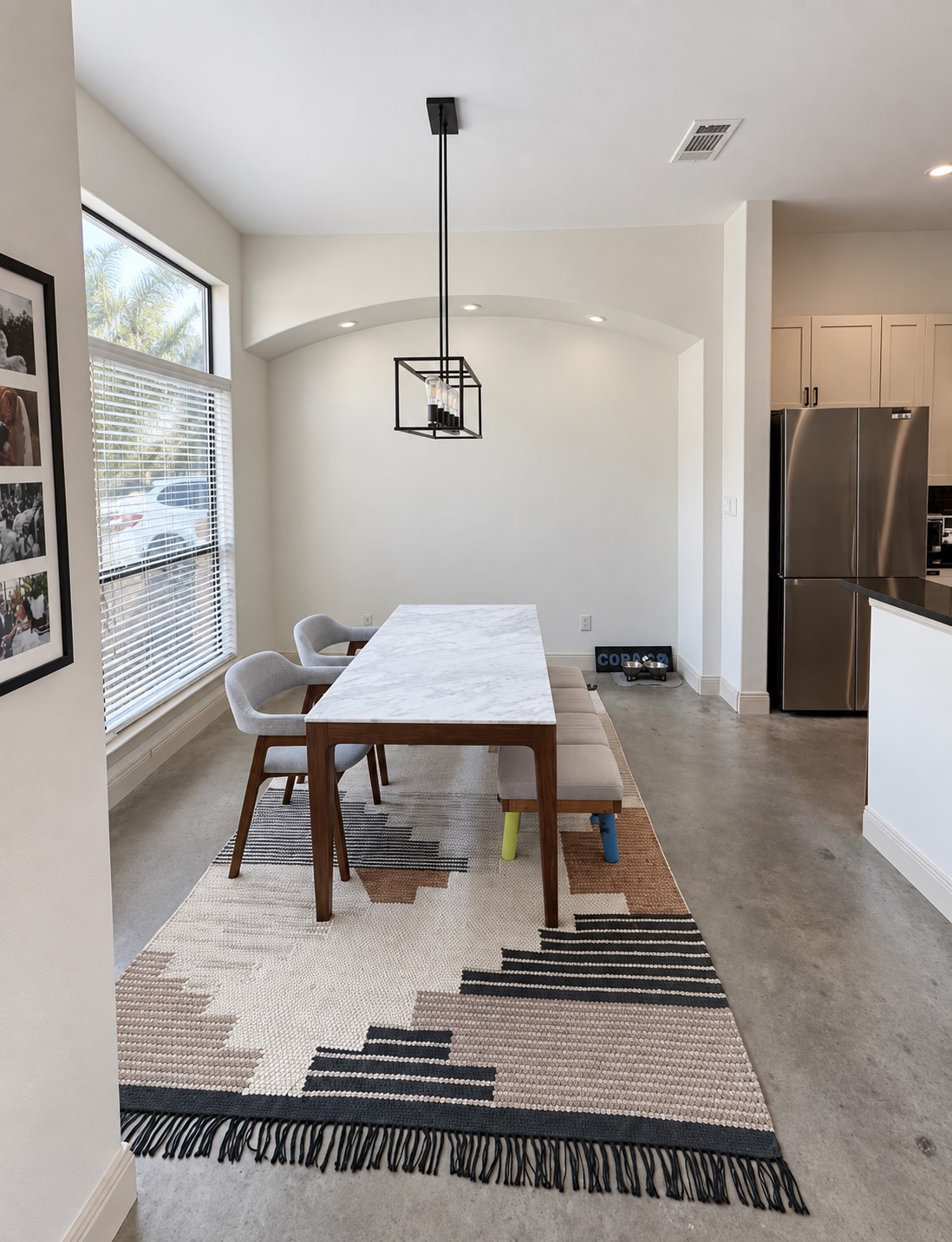 2316 Thornton Road, Unit B Austin, TX 78704 - Photo 8 of 25 Polished concrete floors and high ceilings frame this architectural dining space open to the kitchen.