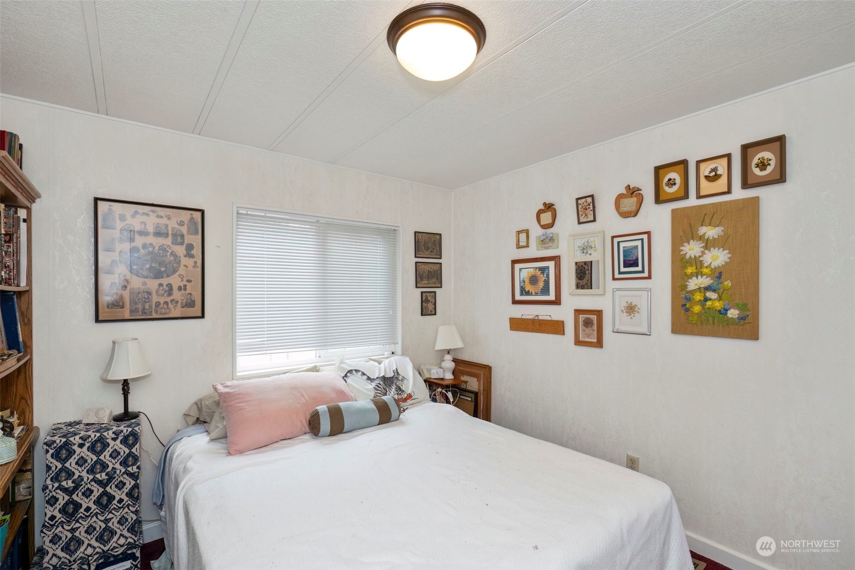 7344 191st Avenue Southwest Rochester, WA 98579 - Photo 12 of 39 a bedroom with a bed and a painting on the wall