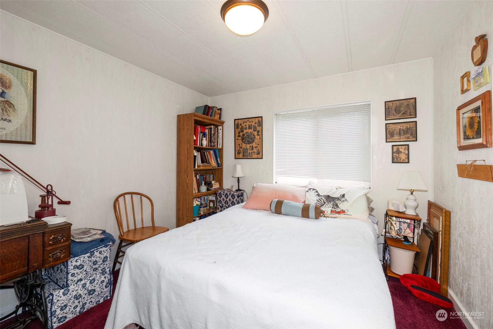 7344 191st Avenue Southwest Rochester, WA 98579 - Photo 13 of 39 a bedroom with bed and a painting on the wall