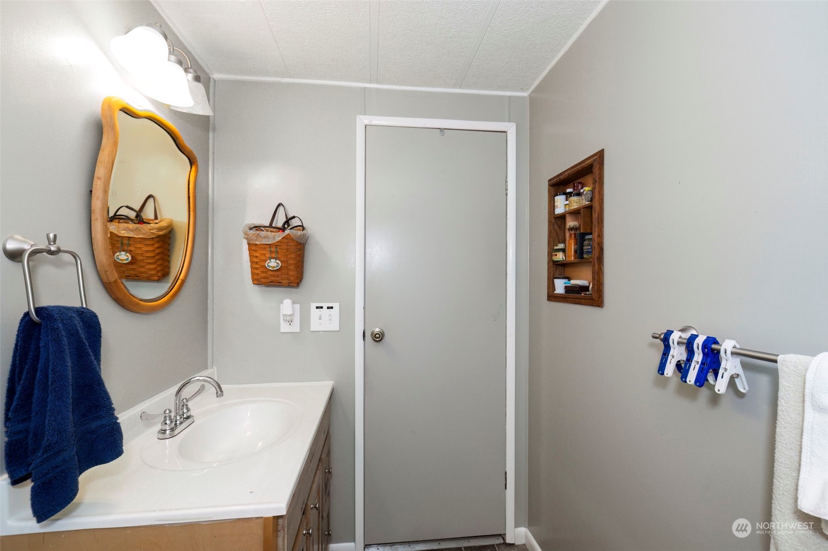 7344 191st Avenue Southwest Rochester, WA 98579 - Photo 15 of 39 a bathroom with a sink and a mirror