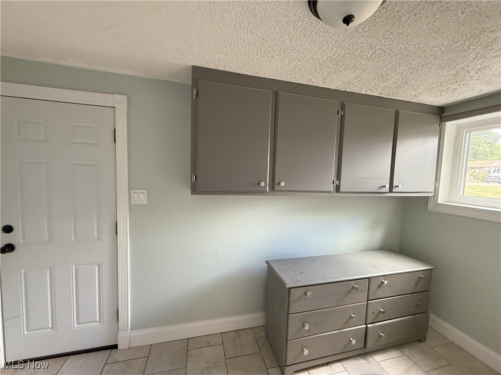 2900 Shellhart Road Barberton, OH 44203 - Photo 27 of 44 Laundry folding area with door to garage