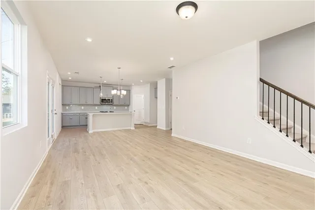 a bathroom with a double vanity sink a mirror and a shower