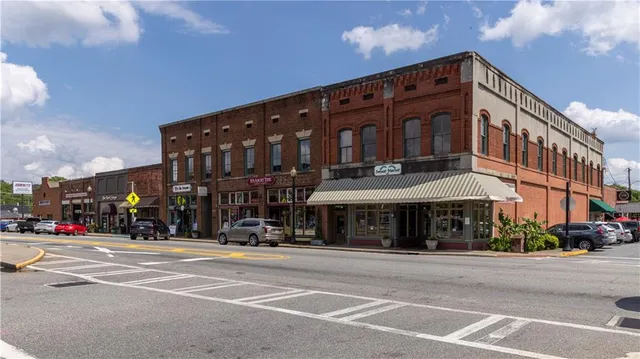 a front view of a building with sitting area
