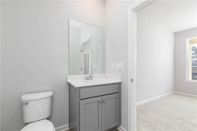 a kitchen with kitchen island a stove a sink a center island and wooden floor