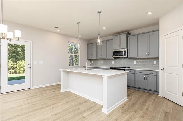 a kitchen with granite countertop a sink and granite counter tops