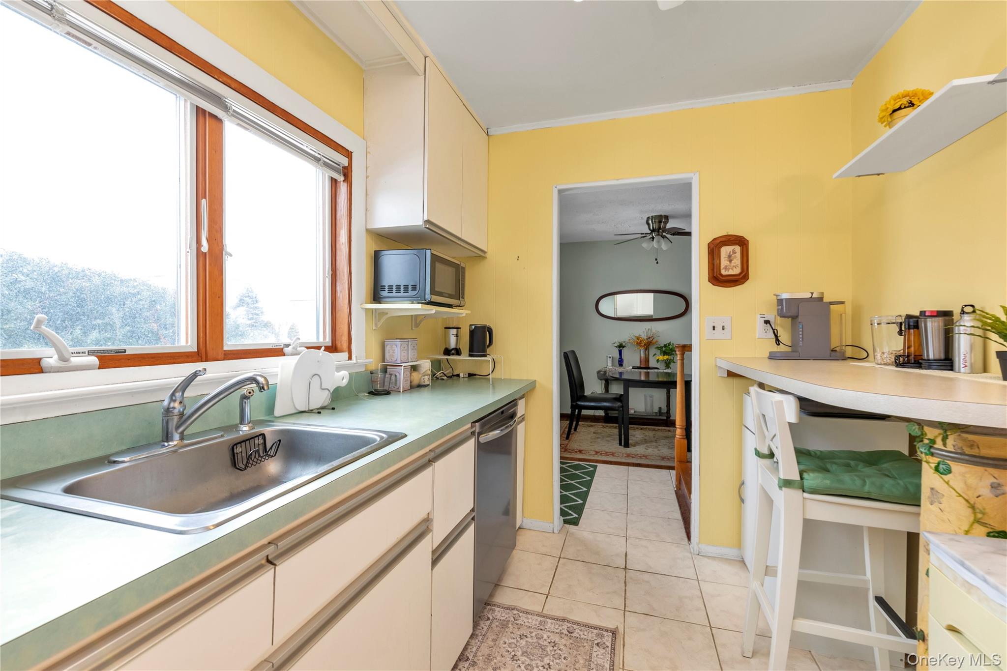 31 Steven Street Plainview, NY 11803 - Photo 3 of 21 a kitchen with a sink cabinets and window