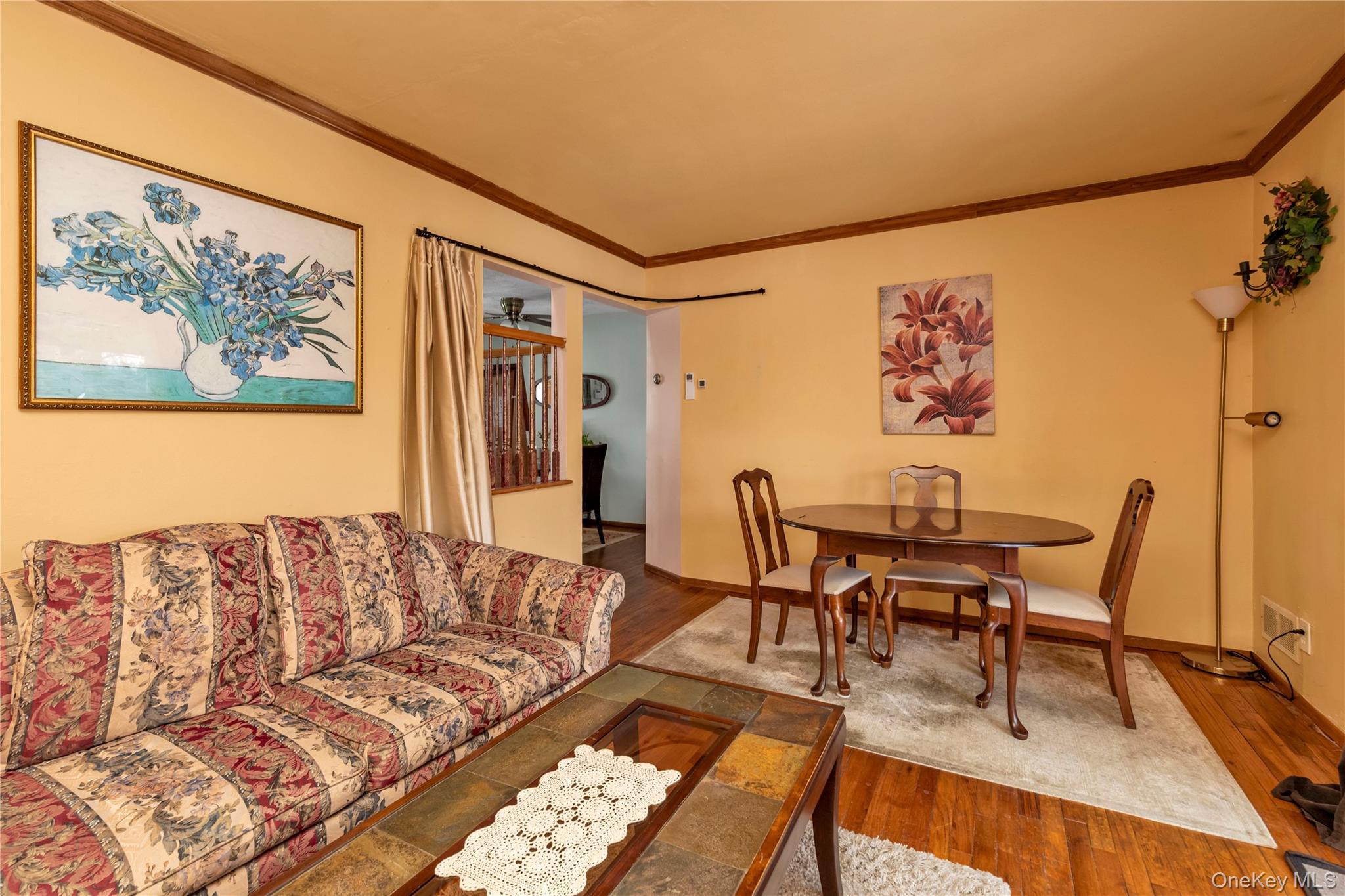 31 Steven Street Plainview, NY 11803 - Photo 6 of 21 a living room with furniture and a wooden floor