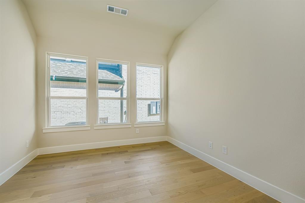 4123 Windy Point Court Oak Point, TX 75068 - Photo 7 of 29 an empty room with a window