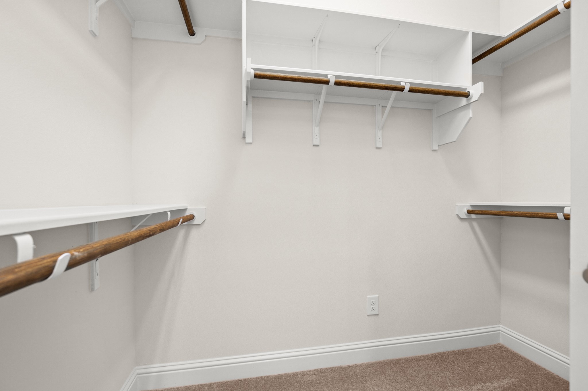 600 C-Bar Ranch Trail, Unit 144 Cedar Park, TX 78613 - Photo 12 of 17 a view of walk in closet with empty racks