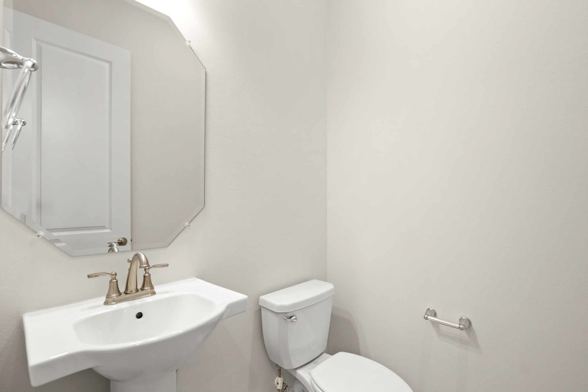 600 C-Bar Ranch Trail, Unit 144 Cedar Park, TX 78613 - Photo 16 of 17 a bathroom with a sink a toilet and a mirror