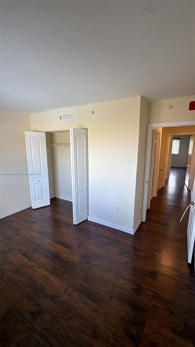12625 Southwest 91st Street, Unit 209 Miami, FL 33186 - Photo 14 of 17 a view of a livingroom with wooden floor