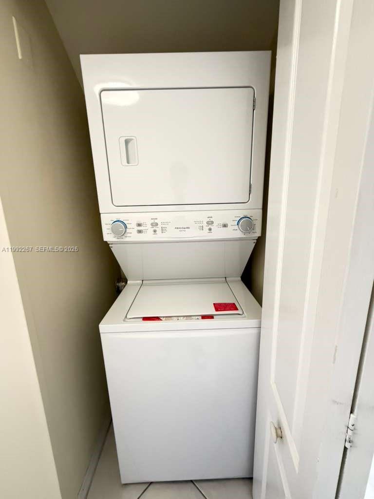 12625 Southwest 91st Street, Unit 209 Miami, FL 33186 - Photo 8 of 17 a utility room with dryer and washer