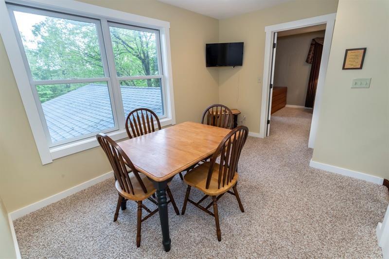 2226 County Line Road Champion, PA 15622 - Photo 22 of 33 a view of a dining room with furniture and a window