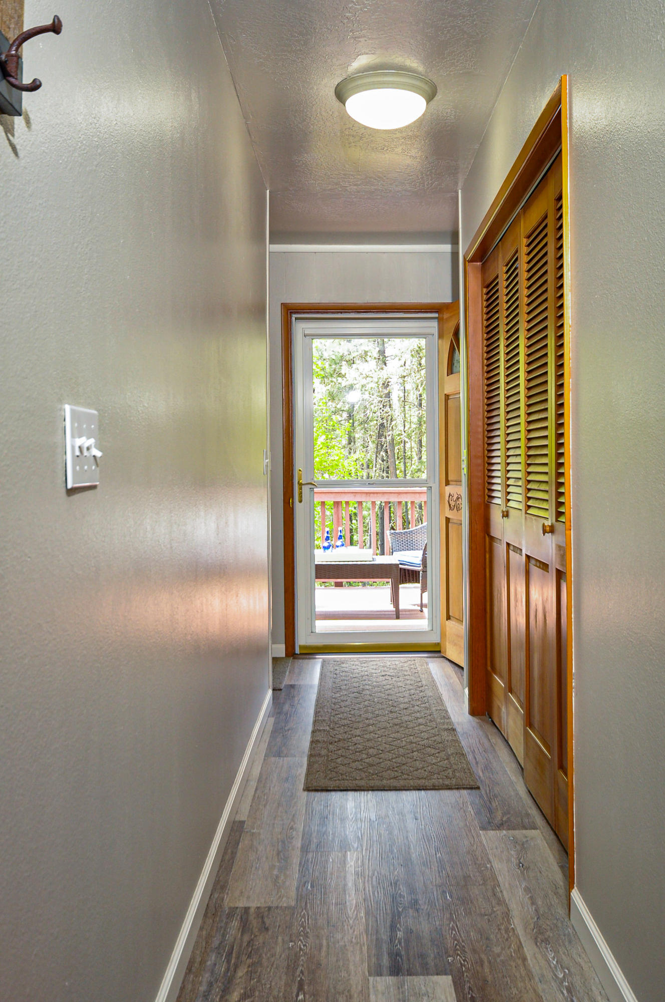 401 West Intervale Road Grants Pass, OR 97527 - Photo 28 of 51 Hall leading to deck from kitchen. Closets on right are laundry area and sink.