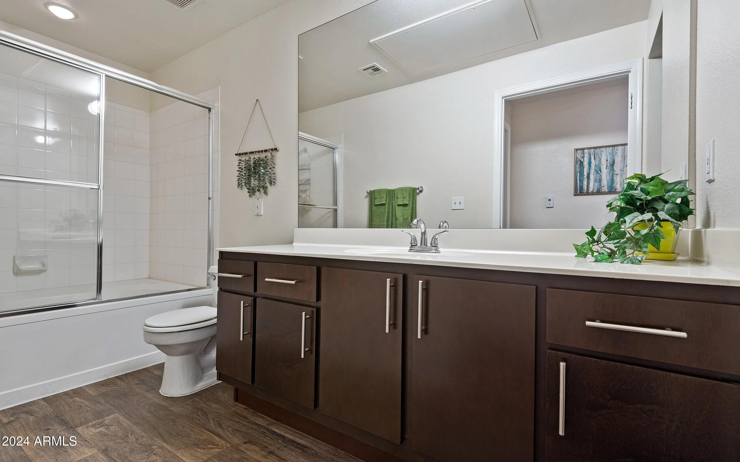 3625 East Ray Road, Unit 1 Phoenix, AZ 85044 - Photo 9 of 29 a bathroom with a sink a toilet and shower