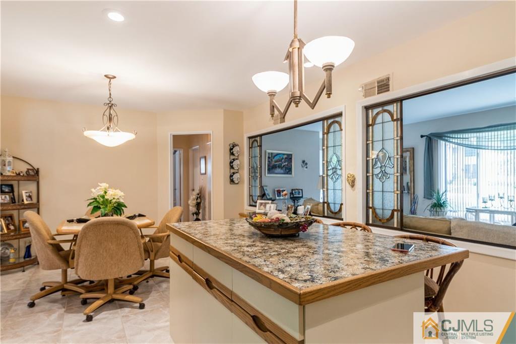 18 Frances Road Edison, NJ 08820 - Photo 12 of 29 a view of a dining room and kitchen counter top space