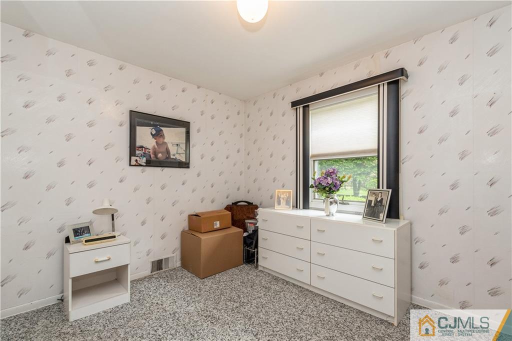18 Frances Road Edison, NJ 08820 - Photo 21 of 29 a room with a couch and a dresser