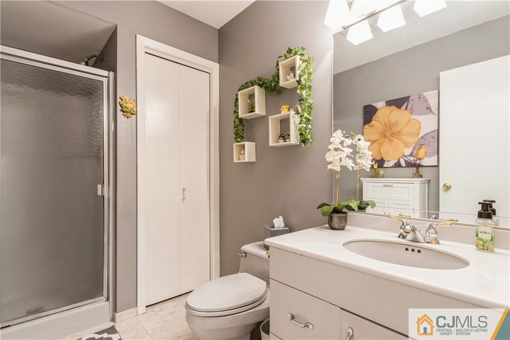 18 Frances Road Edison, NJ 08820 - Photo 23 of 29 a bathroom with a sink toilet and shower