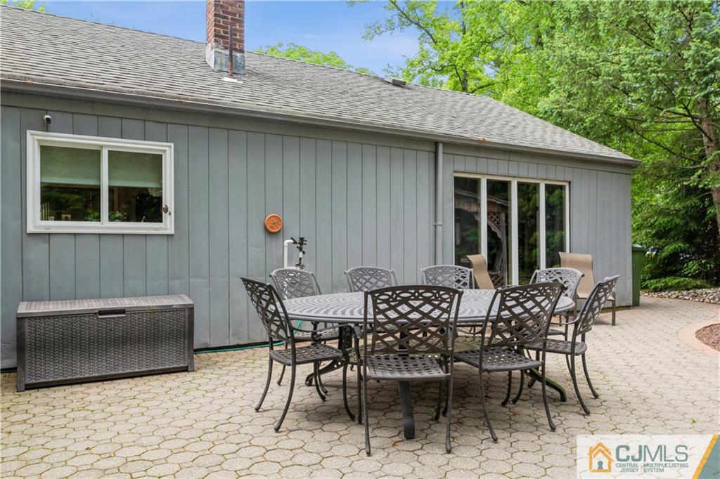 18 Frances Road Edison, NJ 08820 - Photo 26 of 29 a view of a patio with table and chairs and potted plants