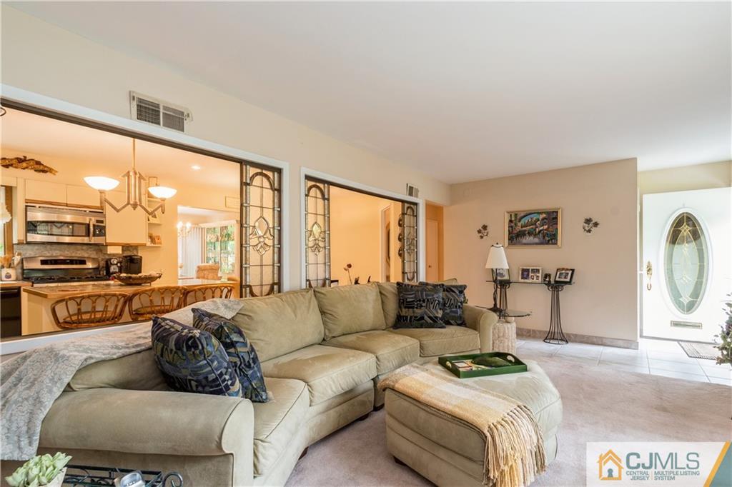 18 Frances Road Edison, NJ 08820 - Photo 5 of 29 a living room with furniture and a large window