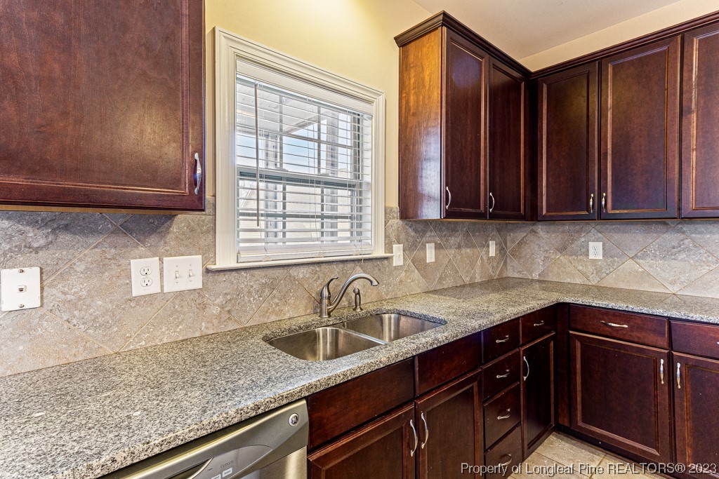 30 Appomattox Drive Cameron, NC 28326 - Photo 12 of 33 a kitchen with stainless steel appliances granite countertop a sink window and cabinets