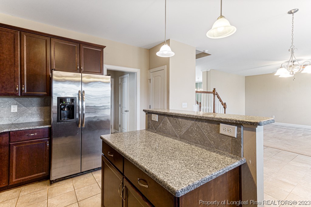 30 Appomattox Drive Cameron, NC 28326 - Photo 14 of 33 a kitchen with stainless steel appliances granite countertop wooden cabinets a refrigerator and a sink