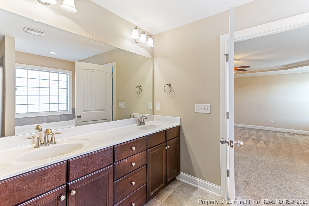 30 Appomattox Drive Cameron, NC 28326 - Photo 16 of 33 a bathroom with a sink double vanity and a mirror