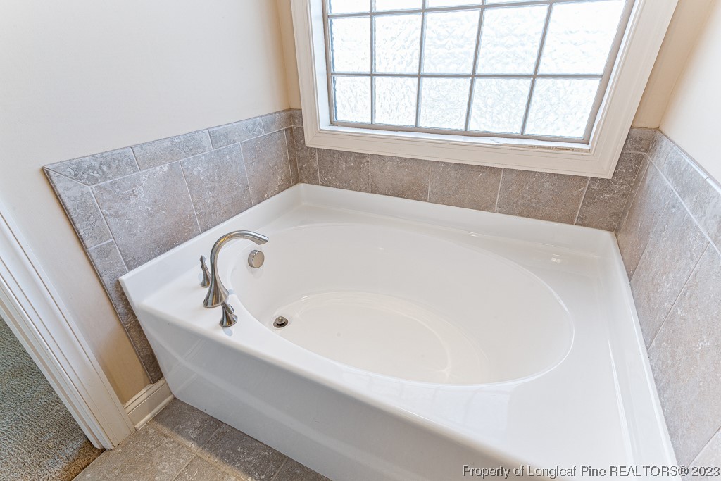30 Appomattox Drive Cameron, NC 28326 - Photo 18 of 33 a white bath tub sitting in a bathroom