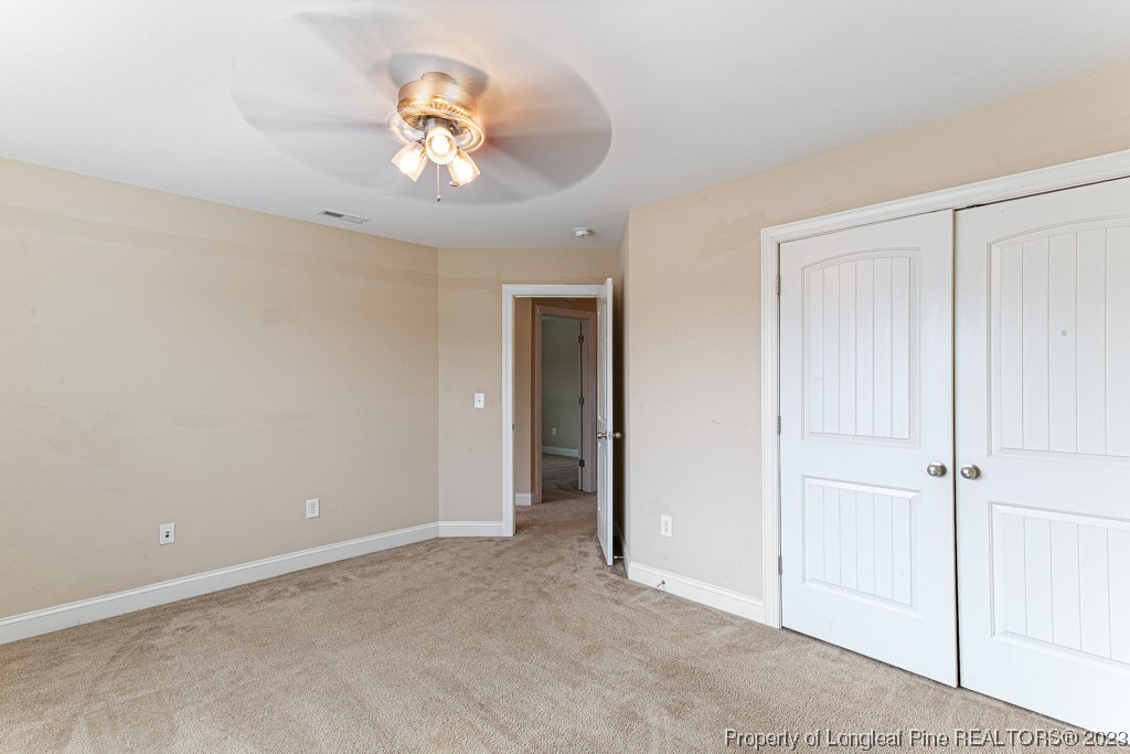 30 Appomattox Drive Cameron, NC 28326 - Photo 20 of 33 a view of an empty room with a chandelier fan