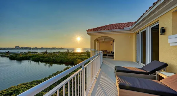 a view of a balcony with chairs