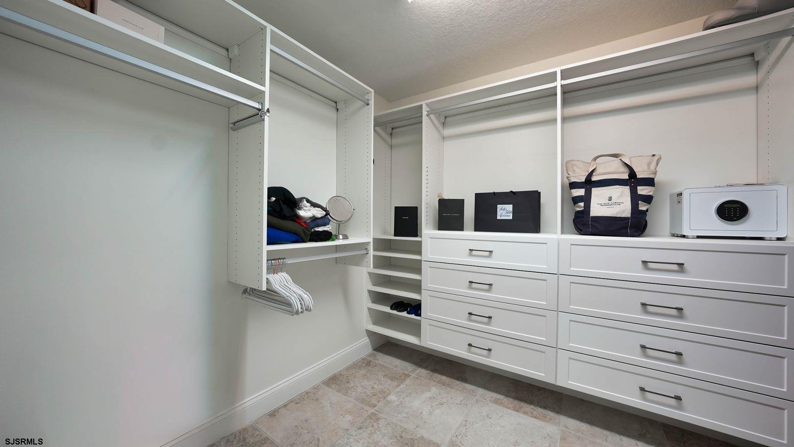 611 Riviera Dunes Way, Unit 702 Palmetto, FL 34221 - Photo 24 of 54 a view of walk in closet
