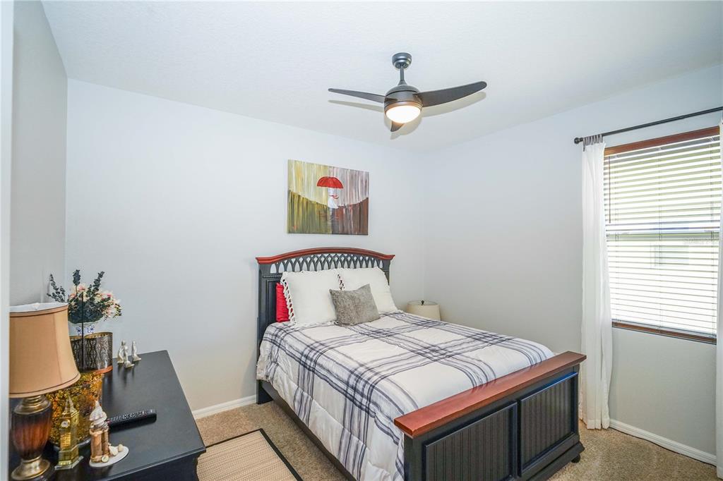 6250 Southwest 89th Ln Road Ocala, FL 34476 - Photo 16 of 71 a bedroom with a bed and a window