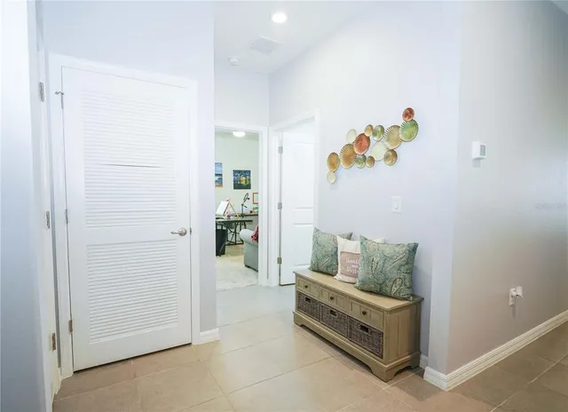 a spacious bathroom with a granite countertop sink a mirror and a