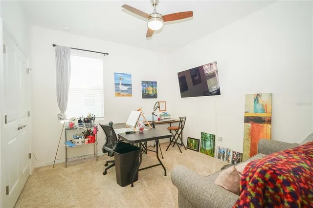 a white toilet sitting next to a white cabinet