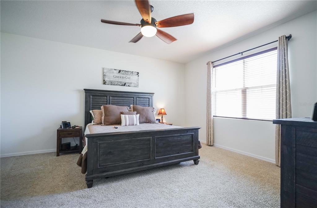 6250 Southwest 89th Ln Road Ocala, FL 34476 - Photo 21 of 71 a bedroom with a bed and a window