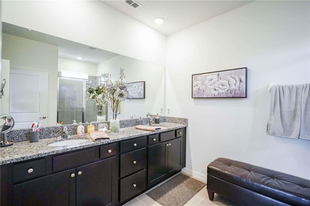 6250 Southwest 89th Ln Road Ocala, FL 34476 - Photo 24 of 71 a bathroom with a granite countertop sink a mirror and a