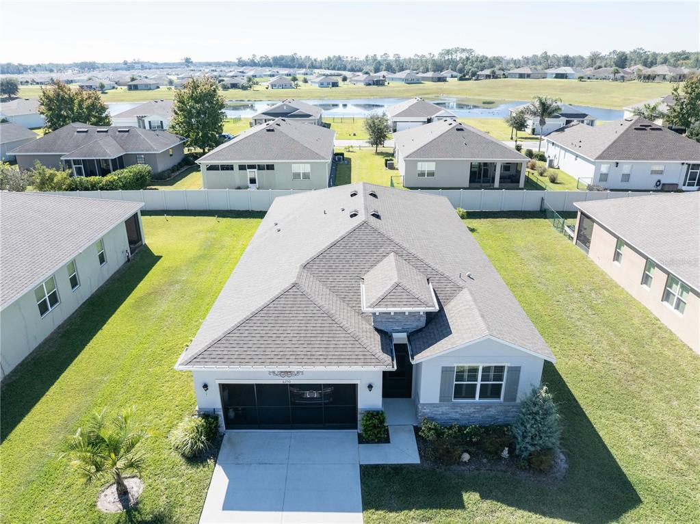 6250 Southwest 89th Ln Road Ocala, FL 34476 - Photo 3 of 71 an aerial view of a house with swimming pool and ocean view