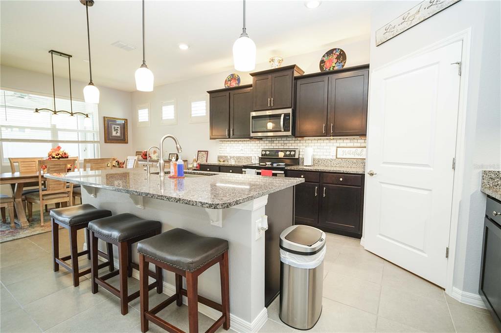 6250 Southwest 89th Ln Road Ocala, FL 34476 - Photo 34 of 71 a kitchen with a sink cabinets and window