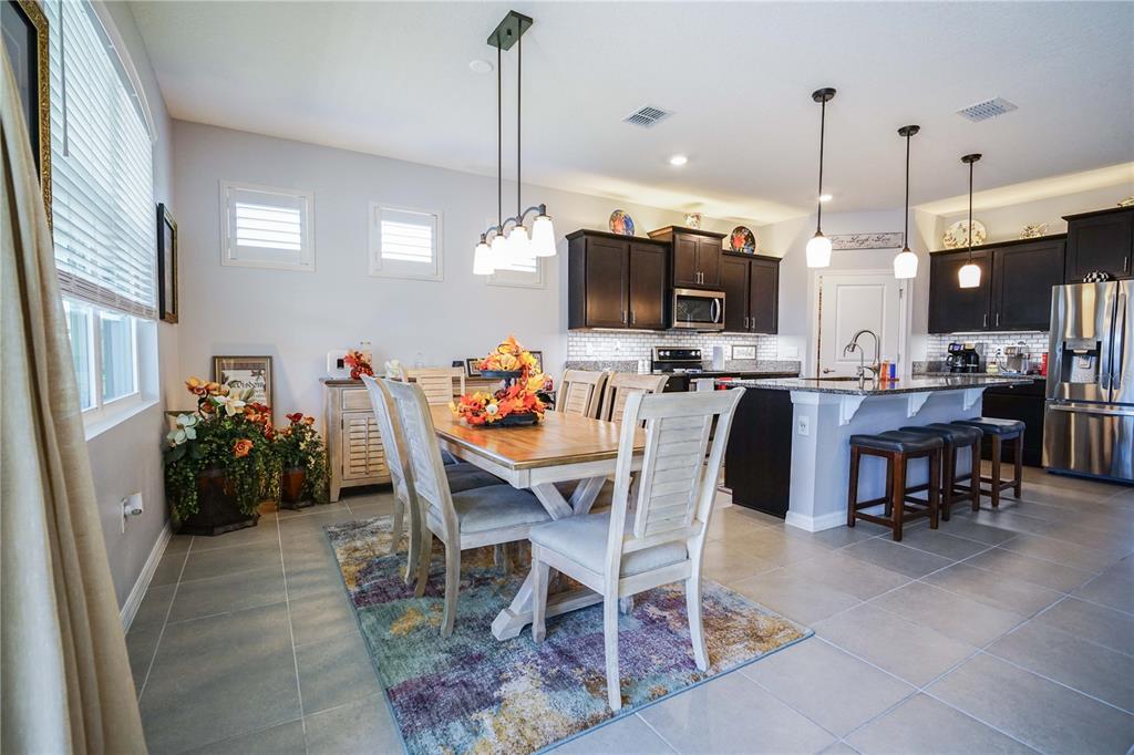 6250 Southwest 89th Ln Road Ocala, FL 34476 - Photo 39 of 71 a view of a dining room with furniture