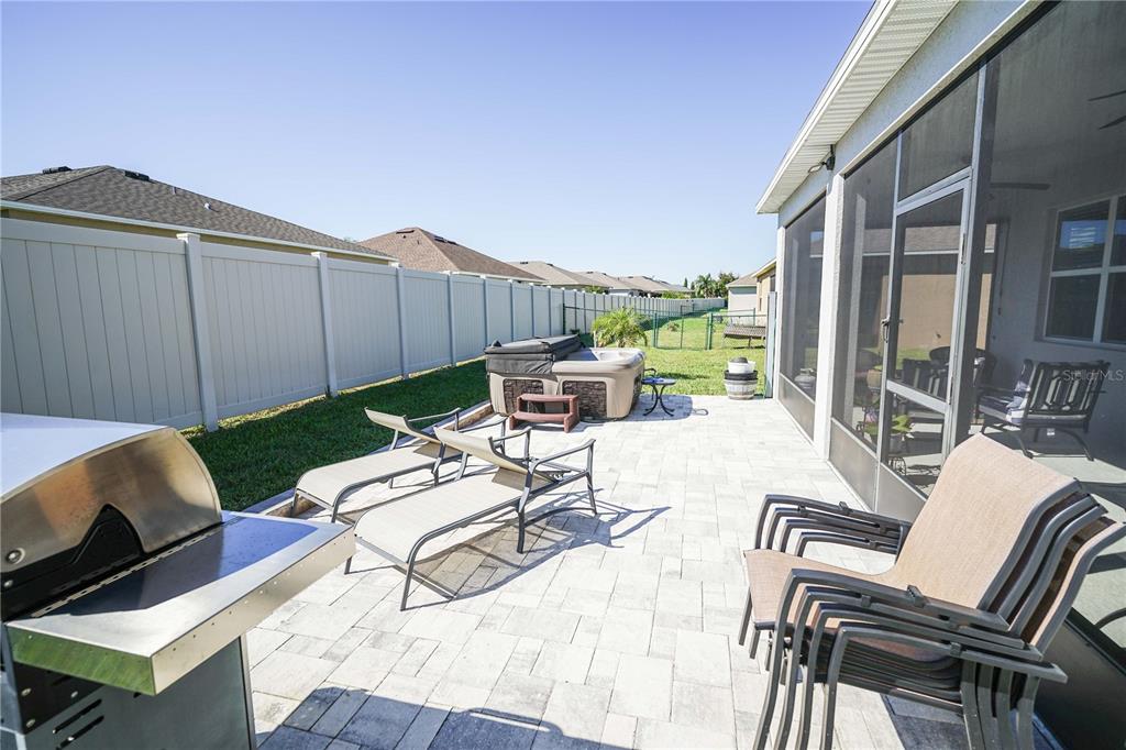 6250 Southwest 89th Ln Road Ocala, FL 34476 - Photo 49 of 71 a view of a patio with couches chairs and potted plants