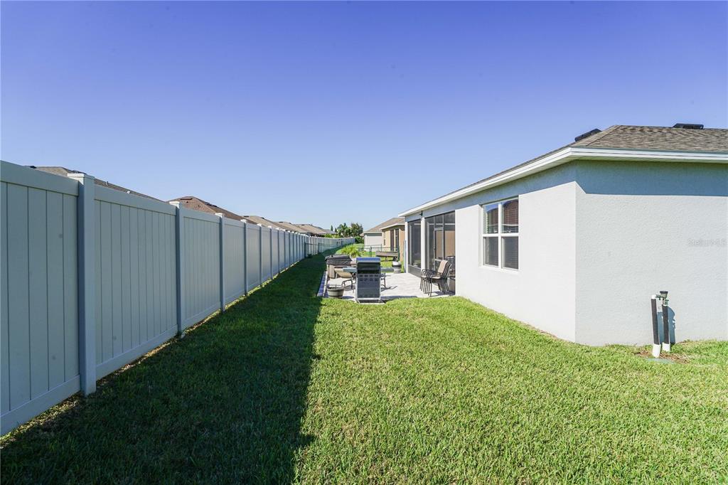 6250 Southwest 89th Ln Road Ocala, FL 34476 - Photo 51 of 71 a view of a house with a yard and a fence