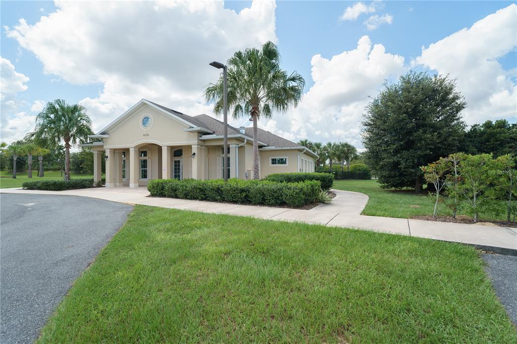 6250 Southwest 89th Ln Road Ocala, FL 34476 - Photo 54 of 71 a front view of a house with a yard