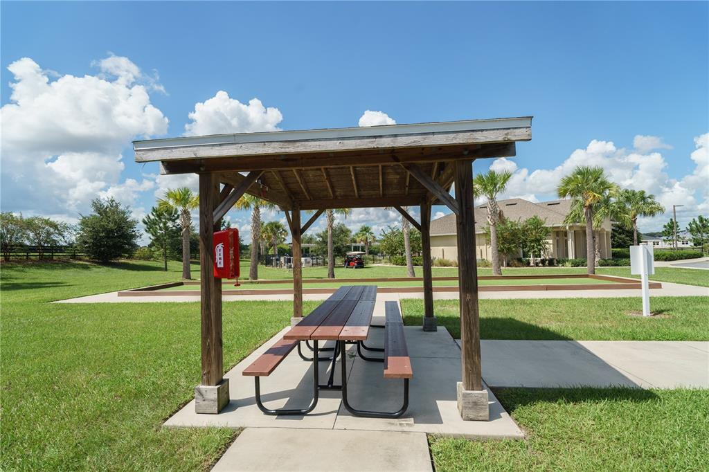 6250 Southwest 89th Ln Road Ocala, FL 34476 - Photo 57 of 71 a view of a porch with furniture and a yard