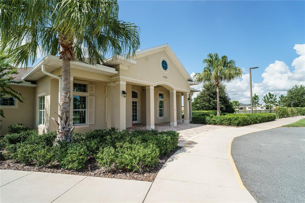 6250 Southwest 89th Ln Road Ocala, FL 34476 - Photo 59 of 71 a front view of a house with a garden