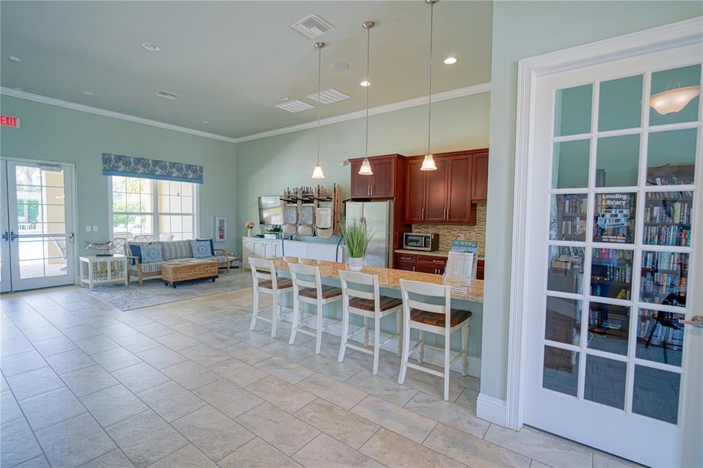 6250 Southwest 89th Ln Road Ocala, FL 34476 - Photo 62 of 71 a view of a dining room with furniture window and wooden floor